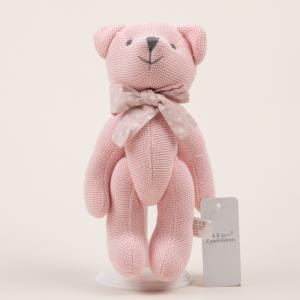 Knitted teddy with bow